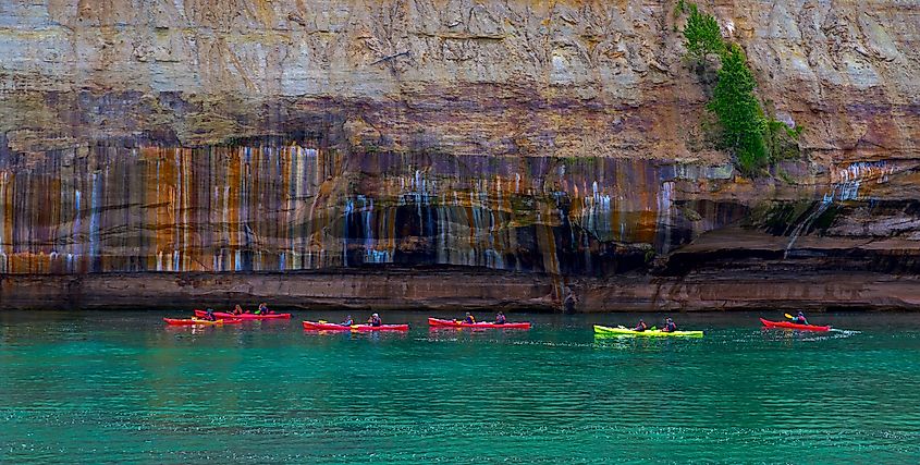 People canoeing at Pictured Rocks National Lakeshore.