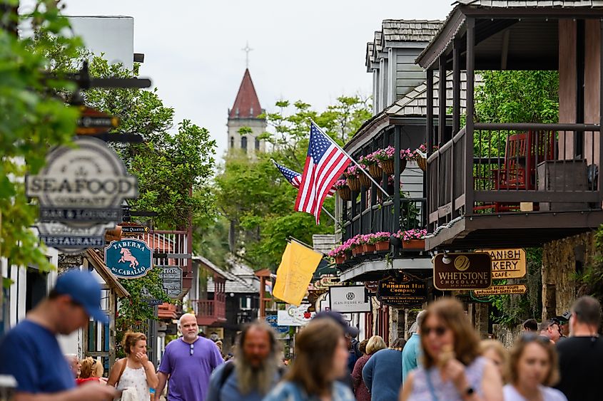 Visitors to St. Augustine, Florida, walk along one of the city's streets.