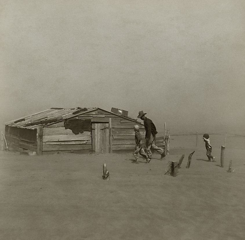 Arthur Rothstein's Farmer and Sons Walking in the Face of a Dust Storm, a Resettlement Administration photograph taken in Cimarron County, Oklahoma, in April 1936.