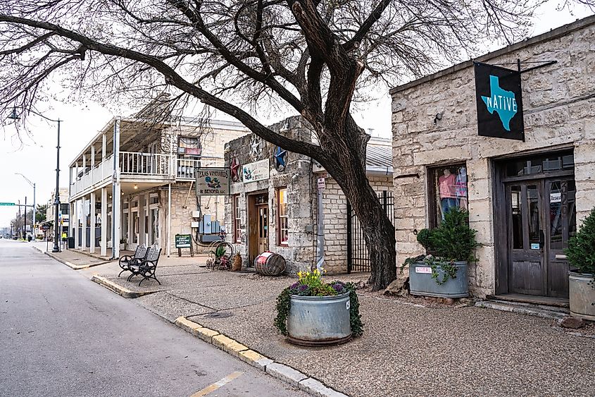 Street scene in Fredericksburg, Texas, featuring historic buildings.