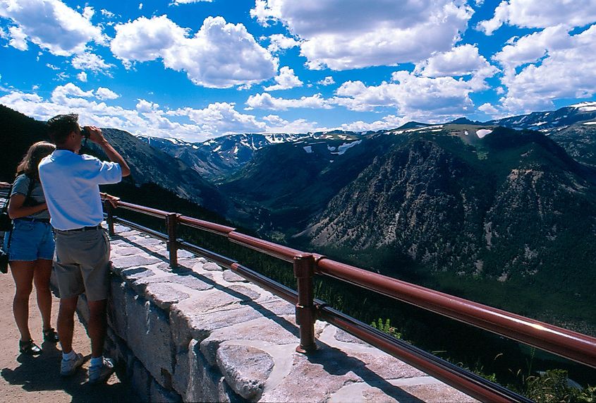 A couple standing at the Rock Creek Vista Point Overlook on Beartooth Highway in Montana