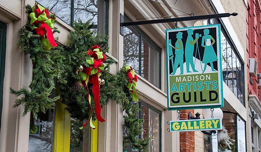 Madison Artists Guild gallery is decorated with festive garland and lights for the Christmas shopping season in Madison, Georgia.