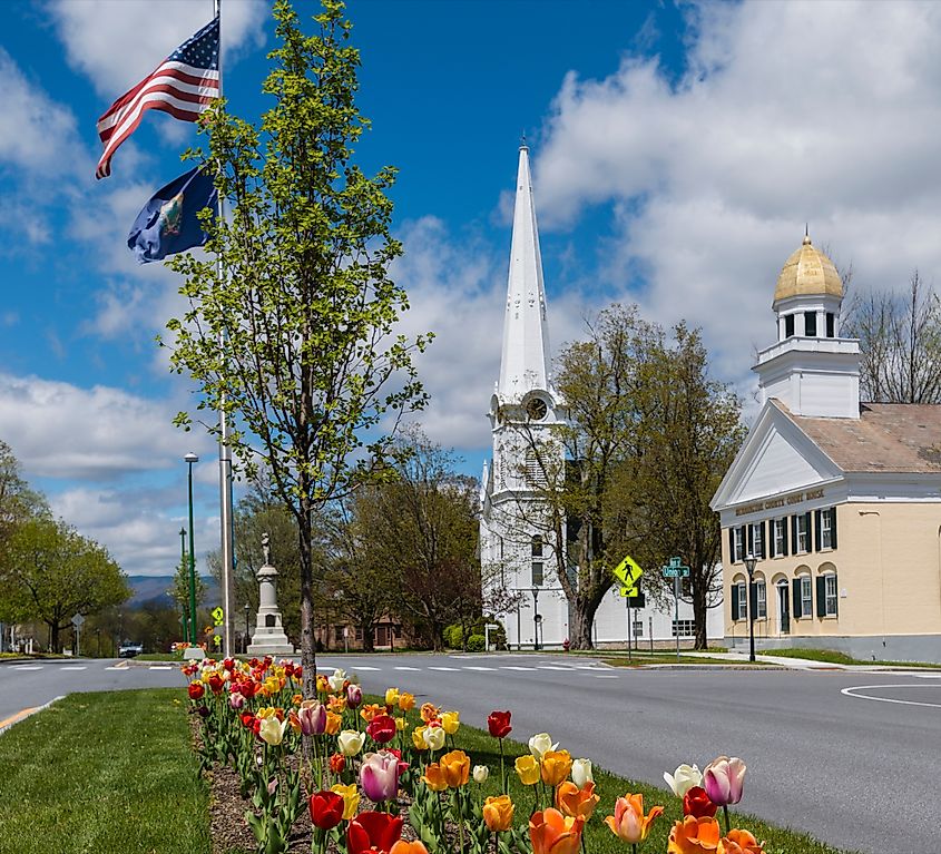 View of the historic and colorful Manchester Village in Manchester, Vermont, with tulips in bloom.