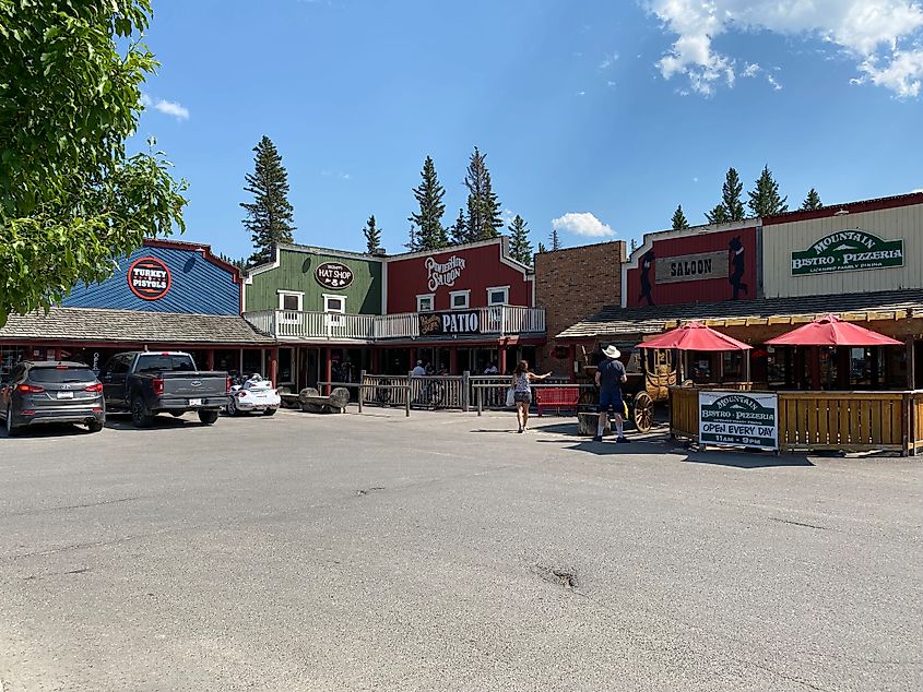 The colorful, Old West style facades of Bragg Creek's main commercial plaza