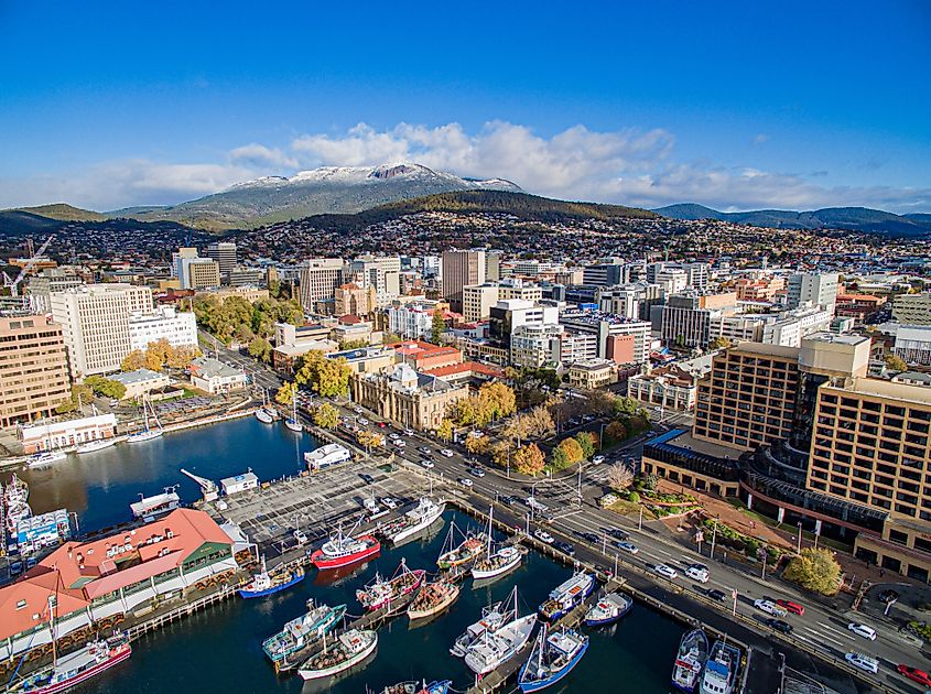 Hobart waterfront and CBD in front of snow capped Mount Wellington, from the air.