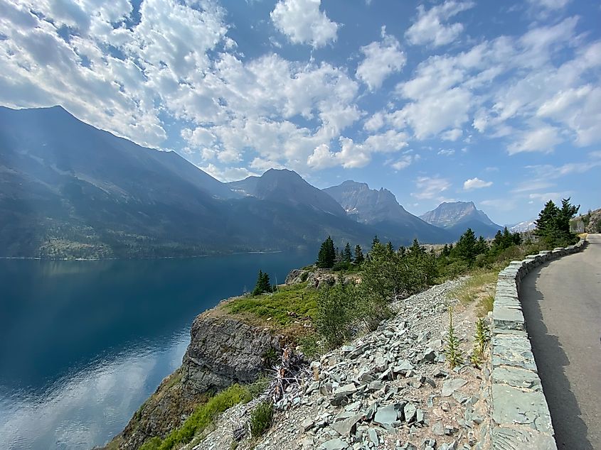 Glacier National Park's Going-to-the-Sun Road: The mountain highway, alpine lake, and Rocky Mountains and come into frame. 