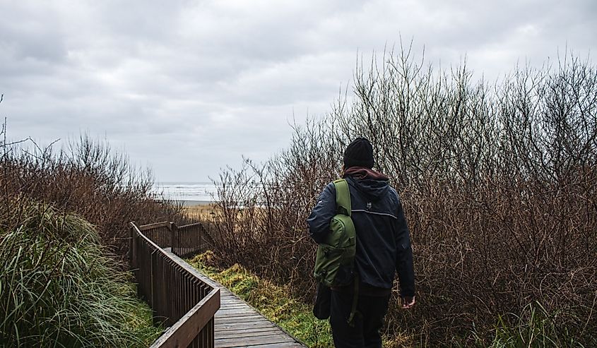 Person walking towards the steps to Copalis Beach, Washington.