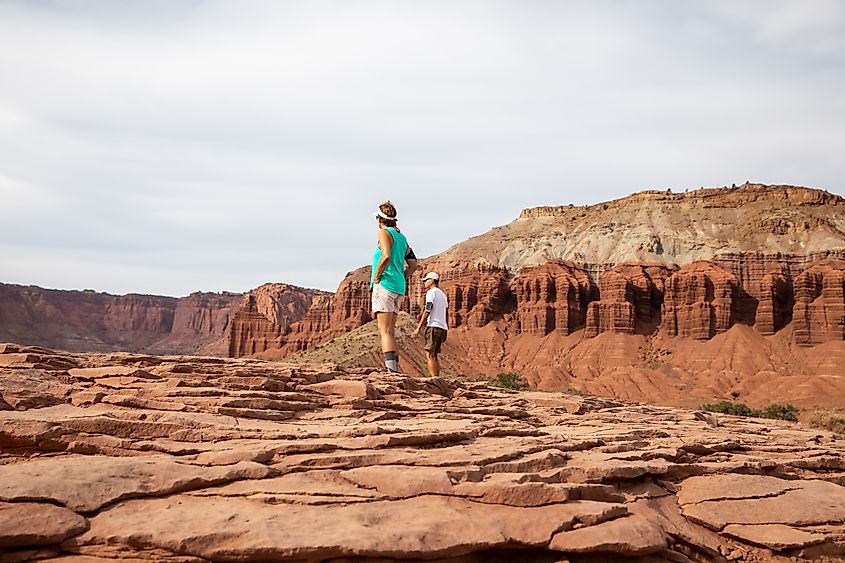 Visitors hike across Capital Reef National Park near Torrey, Utah.