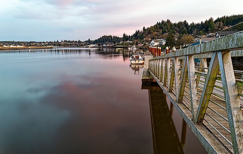 Boat dock at sundown on the Willapa River at South Bend, Washington