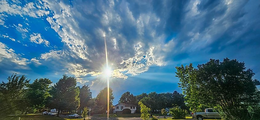 Sun shining over Easton, Maryland as storms clouds slowly approach