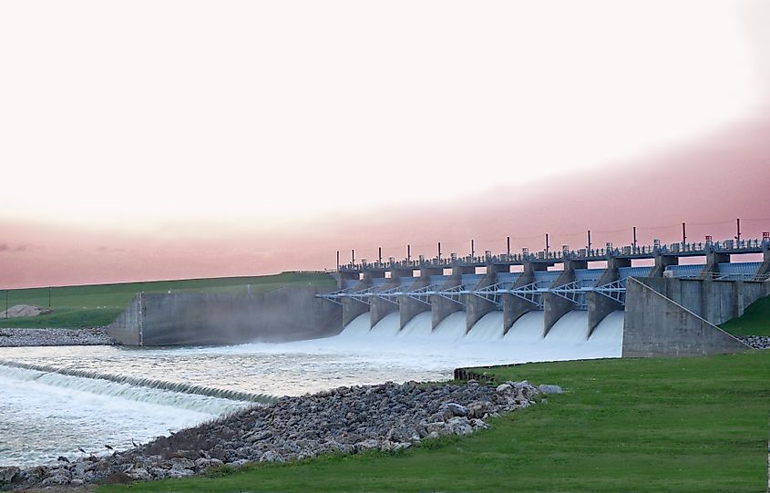 Downstream side of Lake Livingston Dam in Polk County, Texas, showcasing the flowing water and surrounding natural landscape.