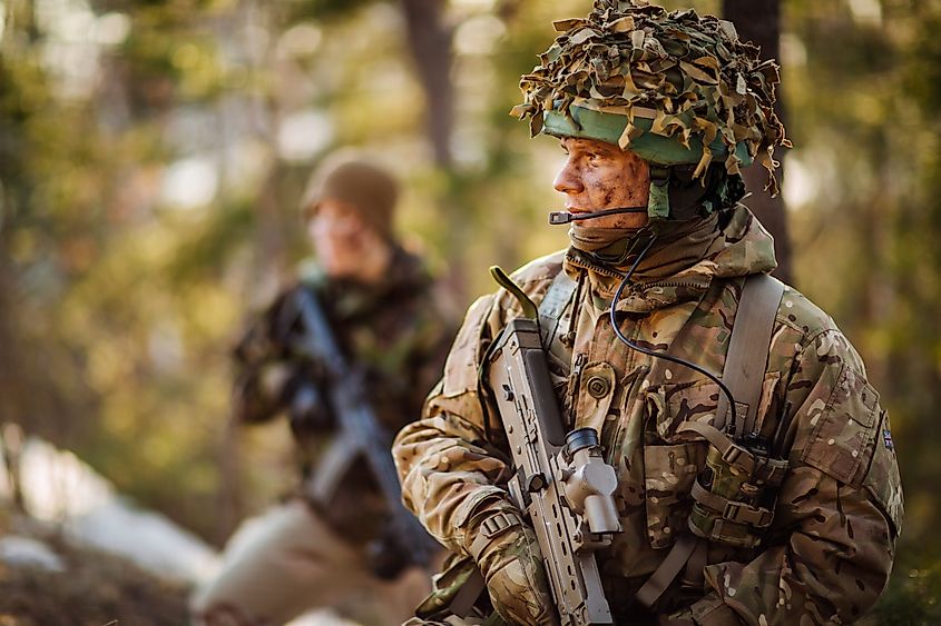 A British soldier looks on during training. 