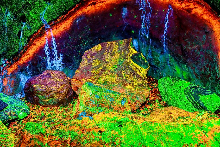 Fluorescent rocks from Sterling Hill Mine glowing with vibrant veins of light under ultraviolet illumination