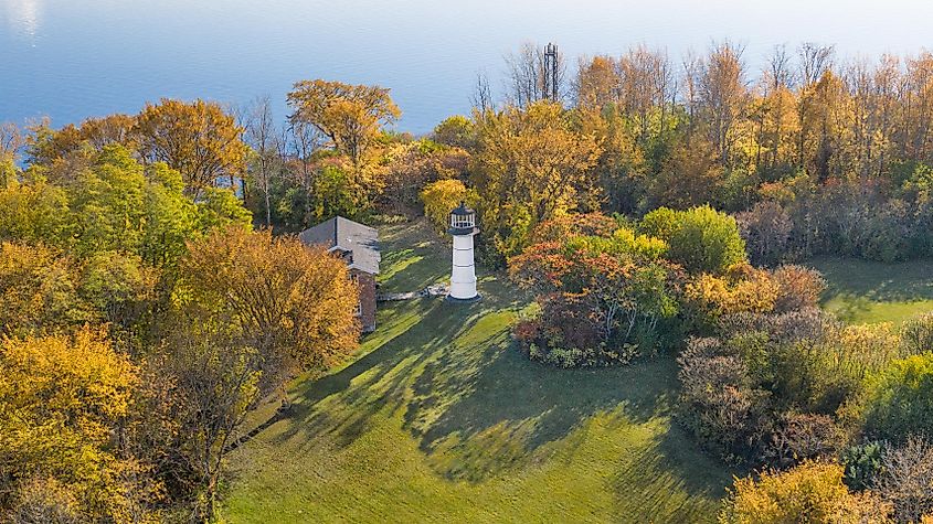 Aerial photo of Juniper Island featuring the Juniper Island Lighthouse during the fall season.