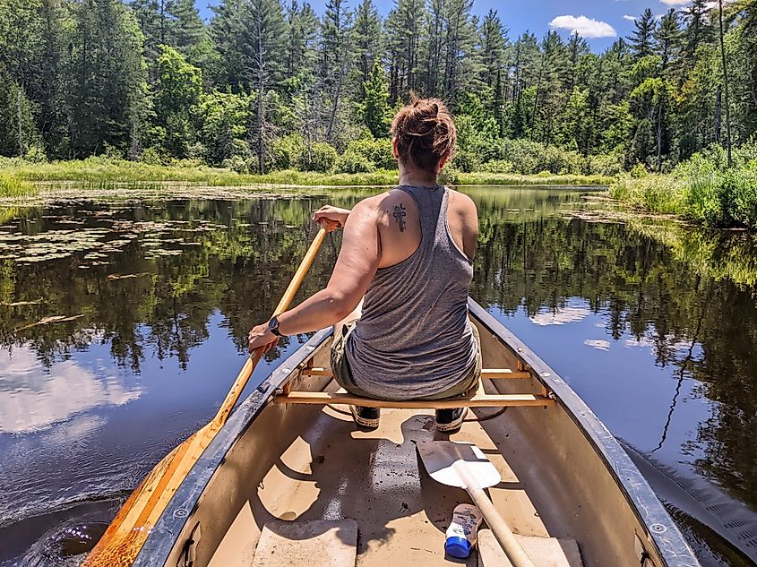 A canoeist on Minerva Stream in the Town of Minerva, New York.