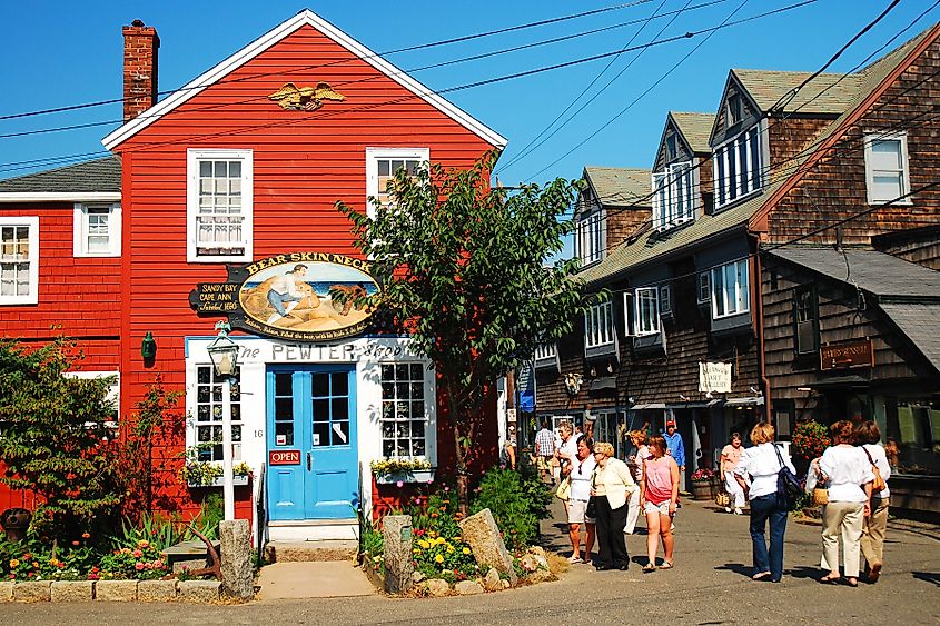 Folks stroll around the unique shops and boutiques on Bearskin Neck in Rockport, Massachusetts. Editorial credit: James Kirkikis / Shutterstock.com