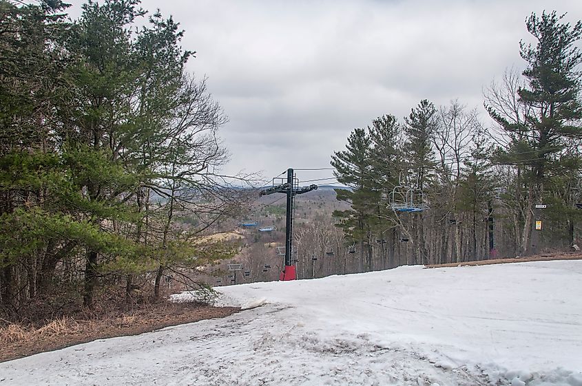 A ski lift on the slopes of mohawk mountain in Cornwall Connecticut on an overcast day.