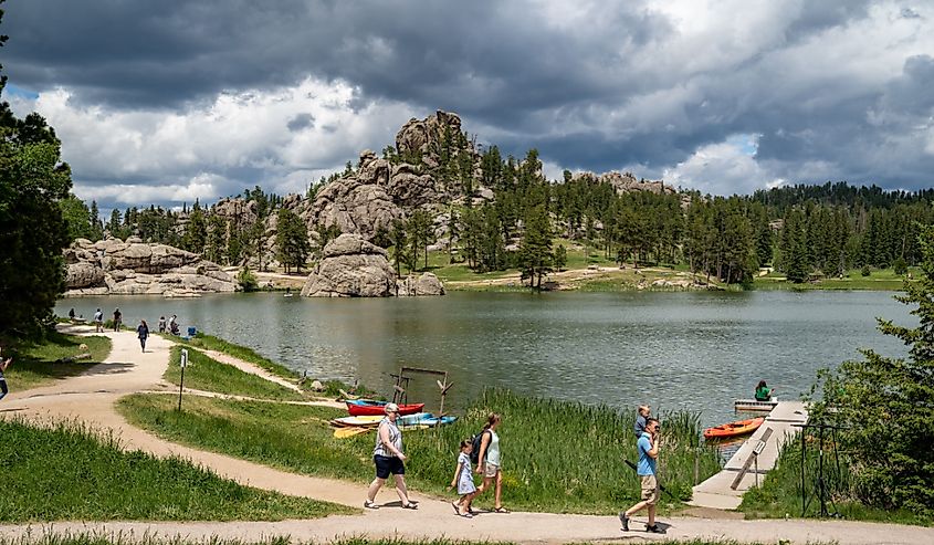 Families enjoy a summer day on Sylvan Lake, in Custer State Park.