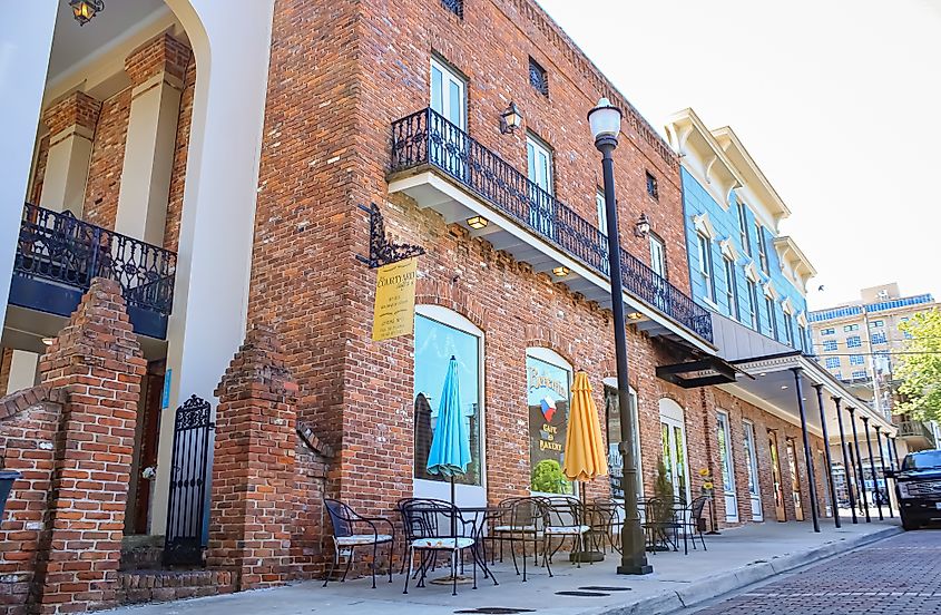 A charming bakery in downtown Vicksburg, Mississippi, housed in a historic brick building with a colorful exterior.