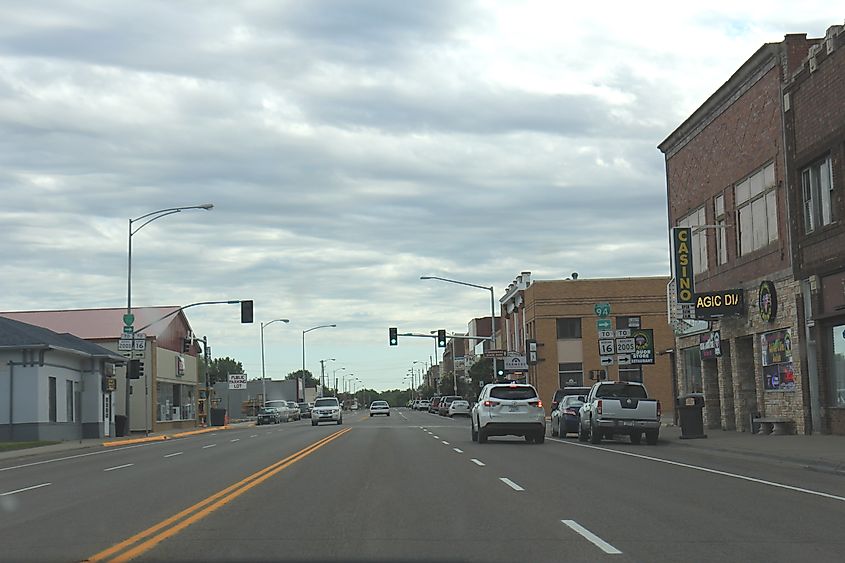 Downtown Glendive, Montana, along Merrill Avenue, featuring historic buildings, local businesses, and a small-town atmosphere.