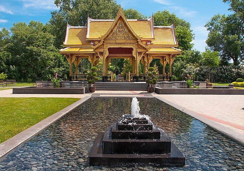 A beautiful Thai Pavilion stands surrounded by bubbling fountains at a Wisconsin public gardens.