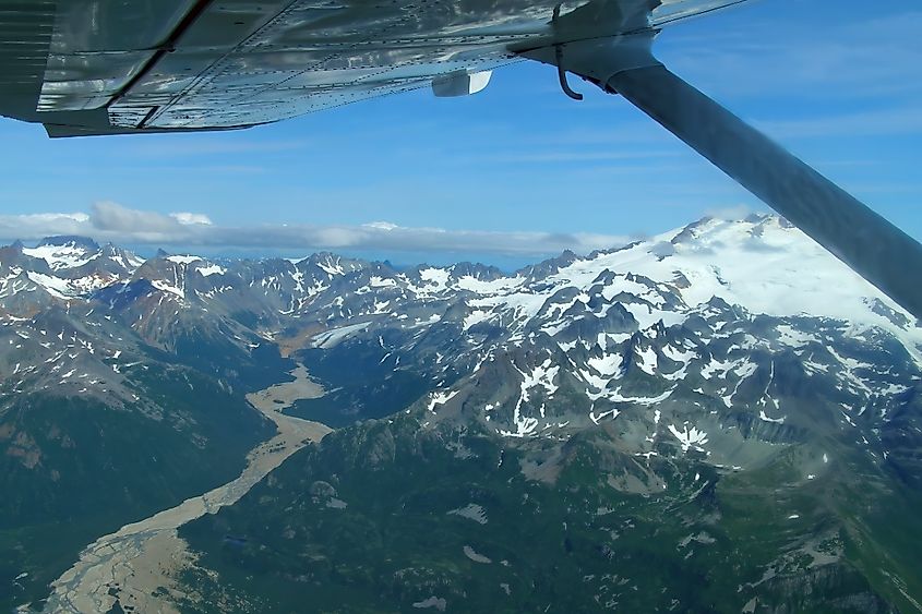 Views of tidal flats, glaciers, and mountain peaks on a sunny sumer day while flying to chinitna bay in lake clark national park, near homer , alaska