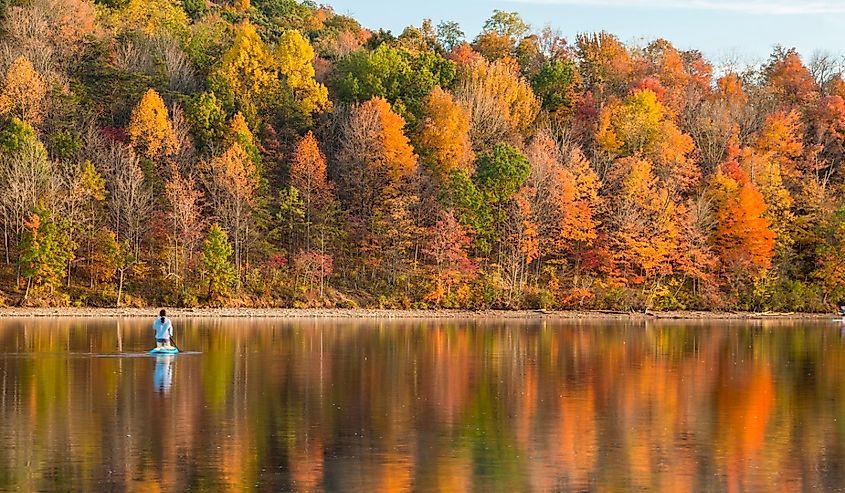 Reflection of the peak autumn foliage in Lake Habeeb in Rocky gap State Park in Maryland