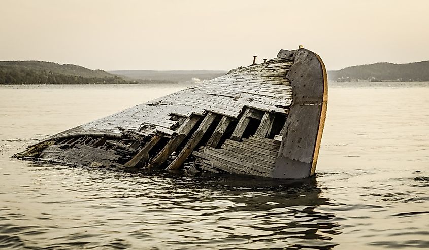 Ghostly wooden shipwreck washed up on the remote shores of Lake Superior, Munising, Michigan.