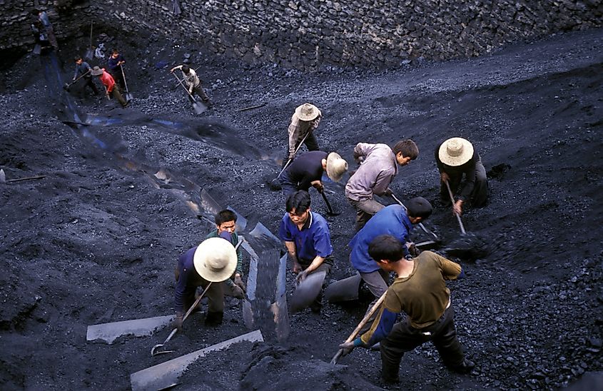 Coal workers in the village of Fengjie in the three gorges valley, China. Source: Shutterstock/amnat30