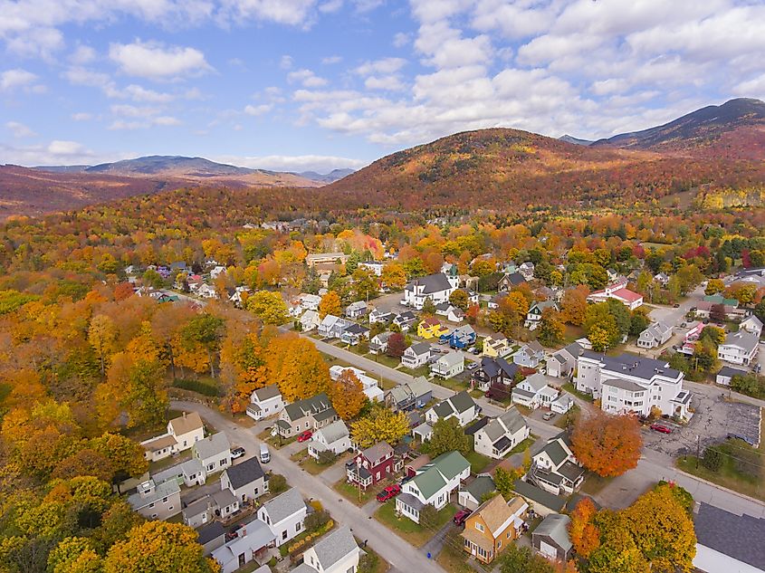 Lincoln Main Street at town center and Little Coolidge Mountain on Kancamagus Highway aerial view with fall foliage.
