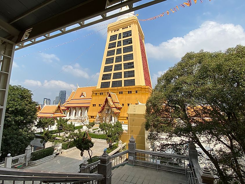 The yellow and white, windowed stupa at Wat Dhammamongkol - Thailand's tallest stupa.