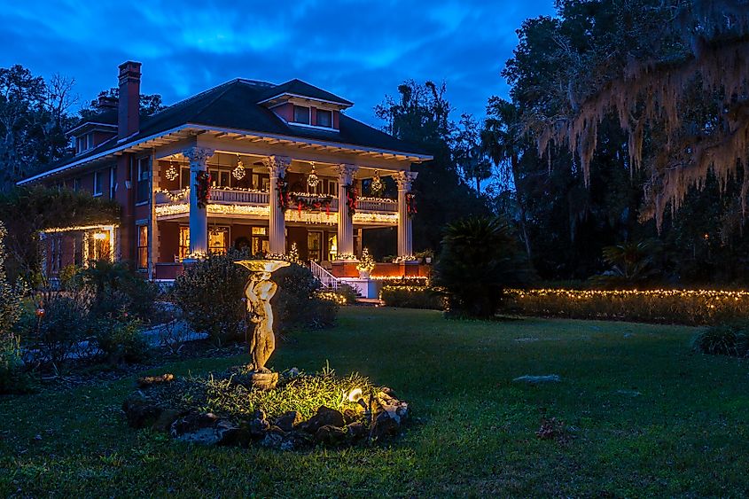 Early evening photograph of Herlong Mansion lit up and decorated for holidays. Editorial credit: H.J. Herrera / Shutterstock.com