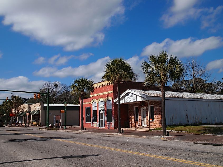  Palm trees and brick buildings from the early and mid 1900's along W. Main Street in Ridgeland, South Carolina. Editorial credit: duckeesue / Shutterstock.com