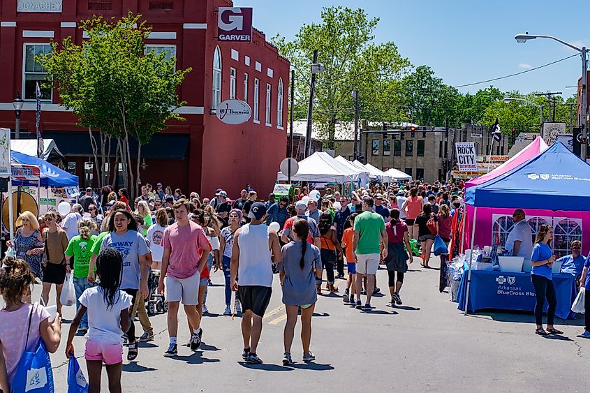 Crowd of people attending a festival in downtown Conway, Arkansas.
