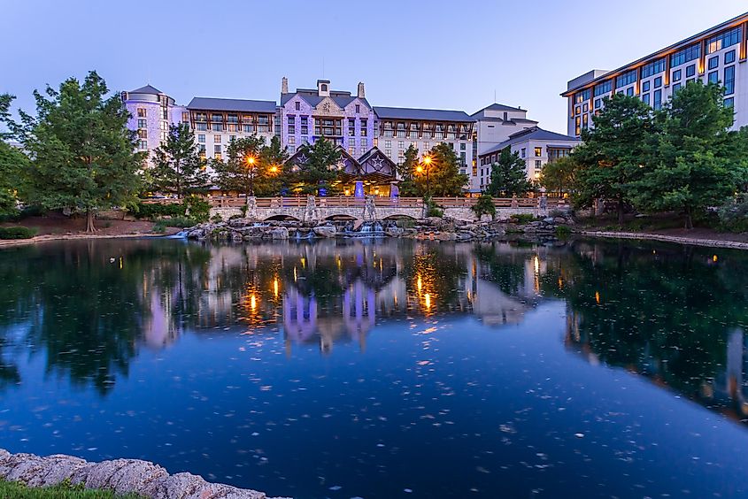 Beautiful Gaylord Texan Resort building over a stone bridge at twilight, via Victoria Ditkovsky / Shutterstock.com