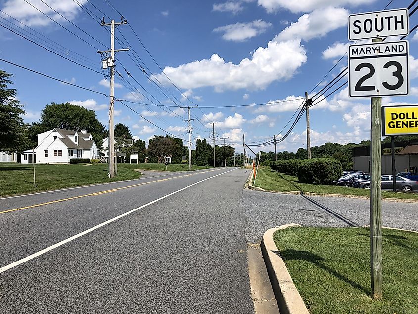 View south along Maryland State Route 23 (Norrisville Road) just south of Maryland State Route 146 (Jarrettsville Pike) in Jarrettsville, Harford County, Maryland.