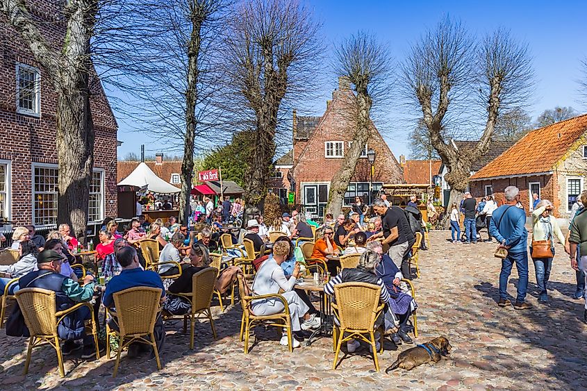 People enjoying the spring weather at a cafe on the market square of Bourtange, Netherlands