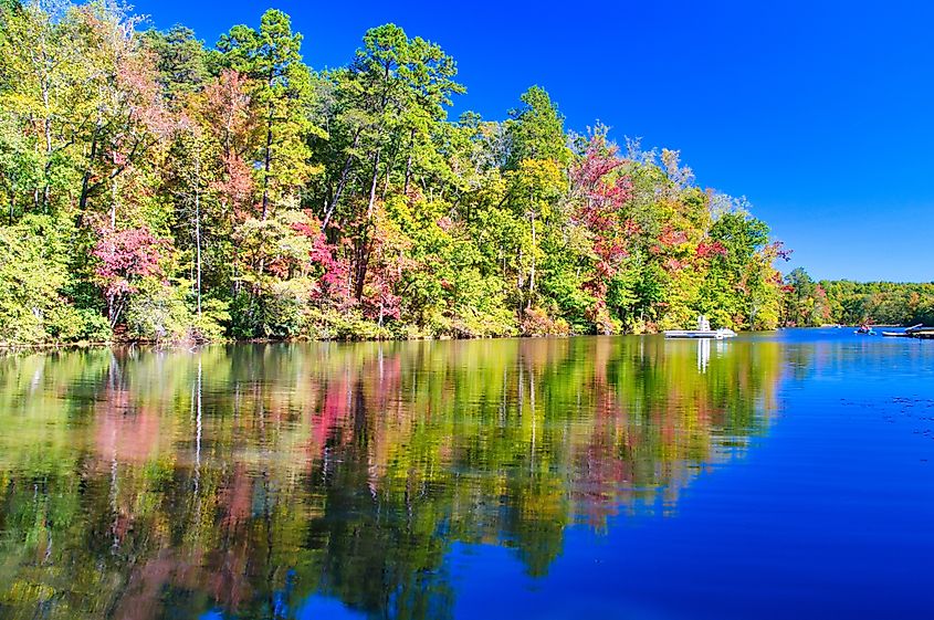 Colorful autumn foliage reflected in the lake at Paris Mountain State Park, South Carolina