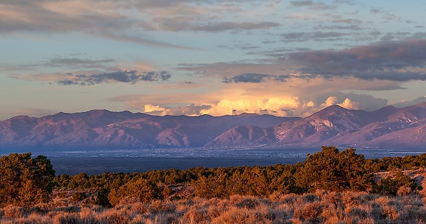 Sunset in Taos Valley, New Mexico, with a thunderstorm east of the Sangre de Cristo Mountains.