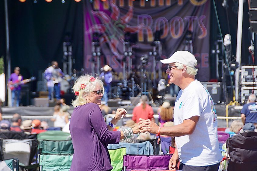 People dancing at an outdoor music festival in Charlestown.