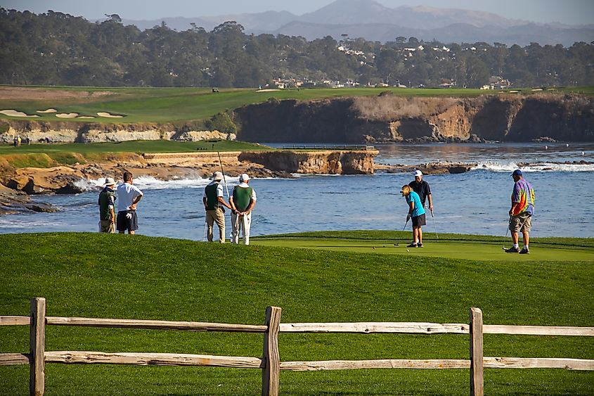 People playing golf in Del Monte Forest, California.