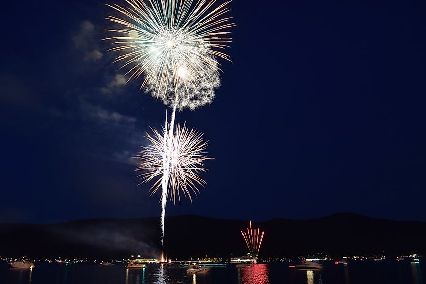 Fireworks on 4th of July lake george upstate New York. Colorful fireworks reflected on lake