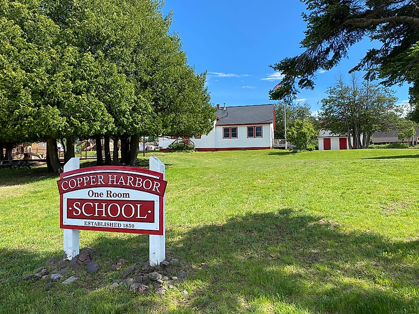 The red and white exterior of Copper Harbor's One Room School, circa 1850.