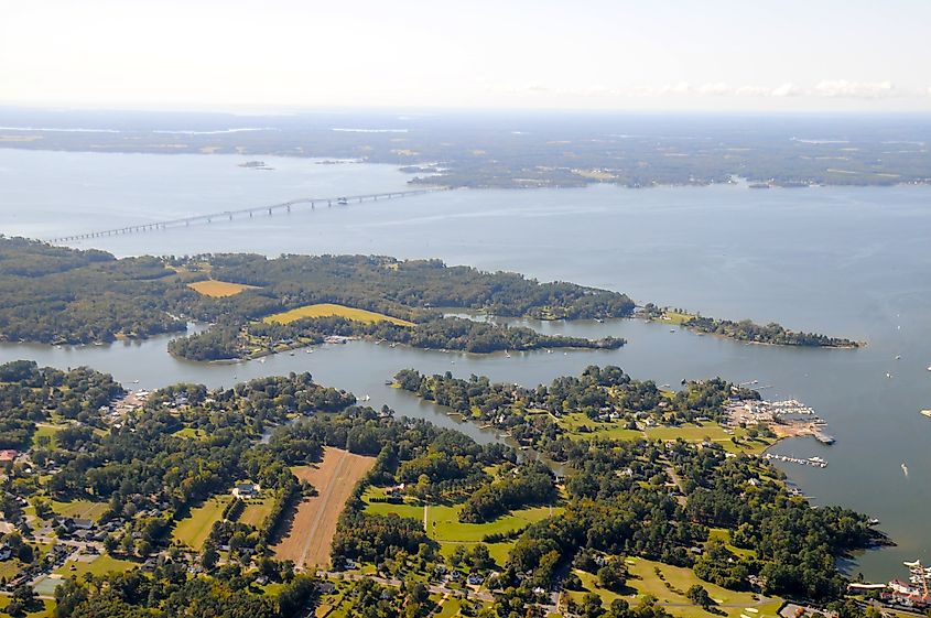 Rappahannock River Yacht Club on Carter's Creek near Weems, Virginia, with the Robert O. Norris Jr. Bridge in the background.