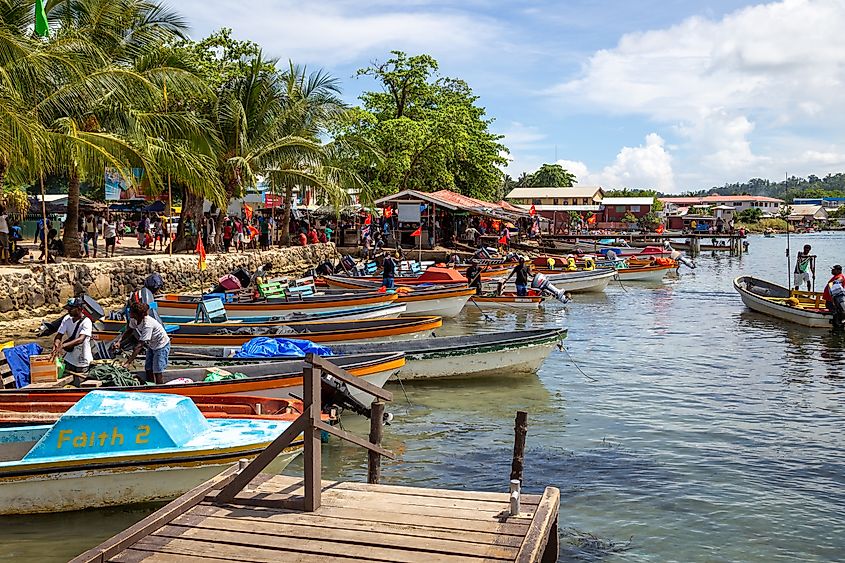 Boats moored along the shoreline in front of Gizo Market in the Solomon Islands. Editorial credit: Sam Lawrence Photography / Shutterstock.com