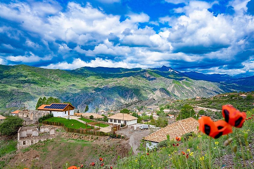 Scenic view of Lachin, Azerbaijan, with mountain roads, restored homes, and landscaped areas in the Karabakh region.