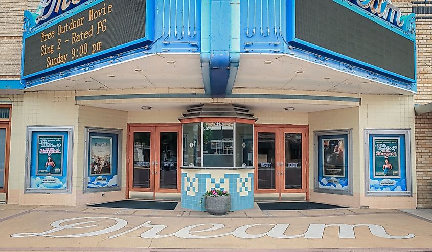 A historic theater building with a blue entrance, Russell, Kansas