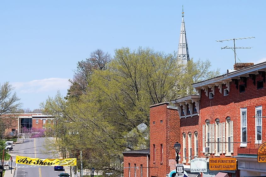 Historic downtown town city in Virginia countryside Shenandoah mountain village, sign for art show and Grace Episcopal church on Washington street