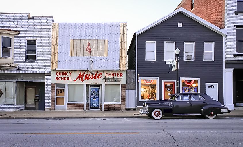 A music store with a classic car parked outside in Quincy, via Sabrina Janelle Gordon / Shutterstock.com