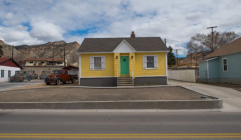 A yellow wooden house in Helper, Utah.